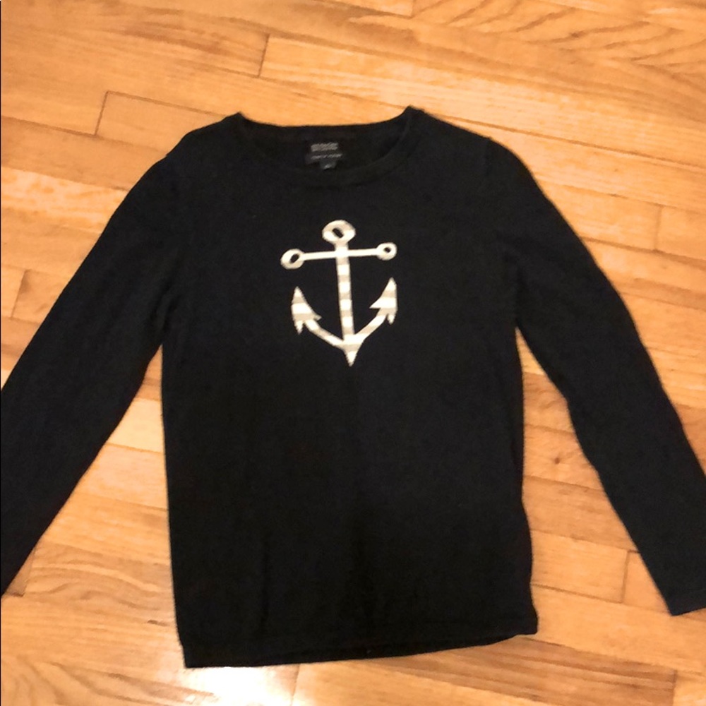 Navy blue sweater with an anchor on the front